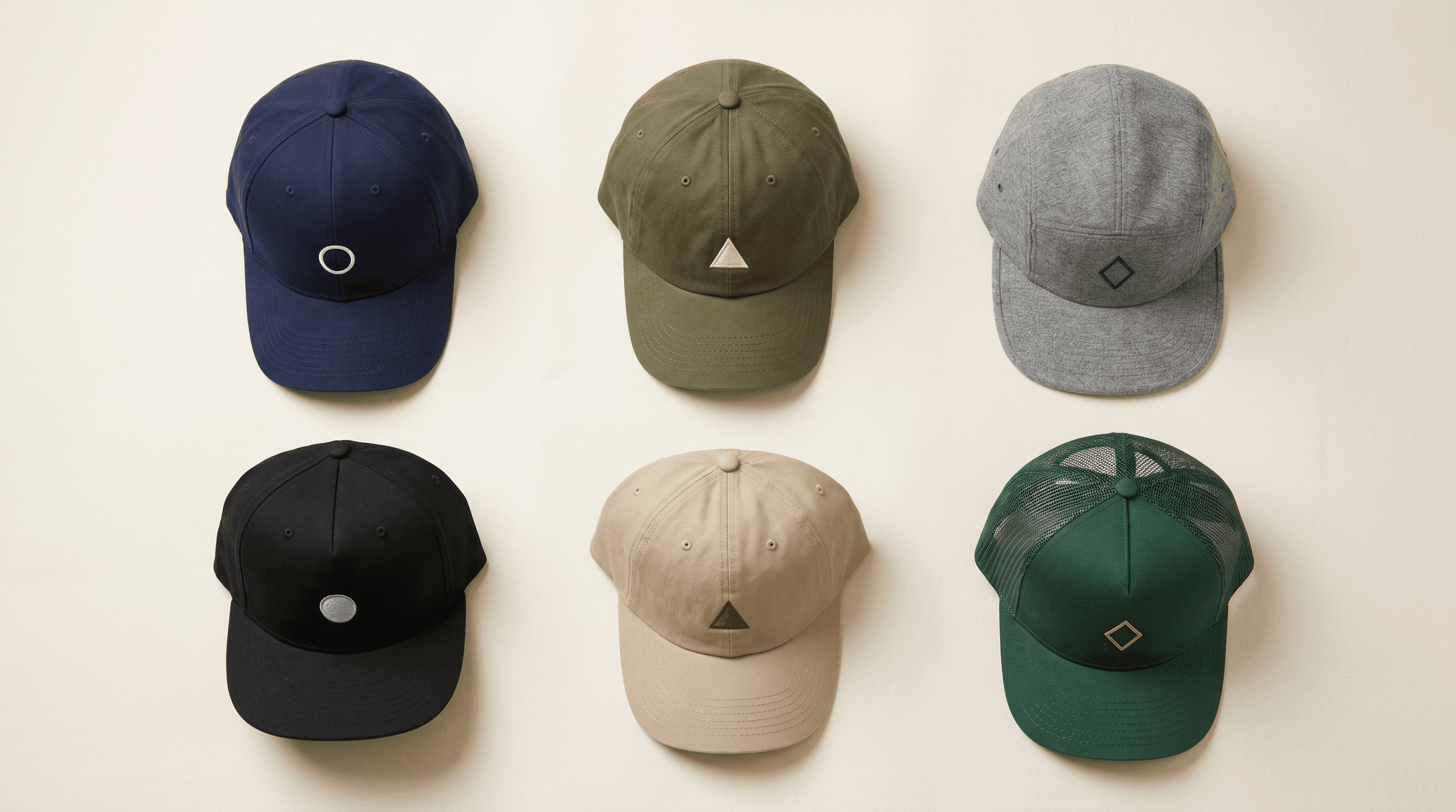 An arrangement of finished USA-made baseball caps in different silhouettes and colors